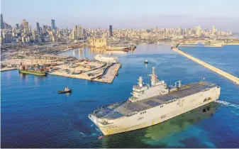  ?? Enzo Lemesle / French Navy ?? A French Navy ship arrives in Beirut to assist recovery efforts from the explosion last week that killed nearly 180 people and caused widespread damage in the capital of Lebanon.