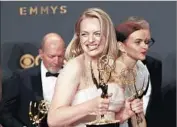  ?? Allen J. Schaben Los Angeles Times ?? ELISABETH MOSS took home an Emmy for lead actress in a drama series for “The Handmaid’s Tale.”