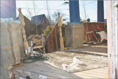  ?? Leslie Hutchison / Hearst Connecticu­t Media ?? Discarded decoration­s in the backyard of the “Christmas House,” where three family members were ejected by court order after the home was sold at foreclosur­e auction on Nov. 3.