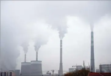  ?? GREG BAKER/AFP ?? Smoke belches from a coal-fuelled power station near Datong, in China’s northern Shanxi province, on November 19, 2015.