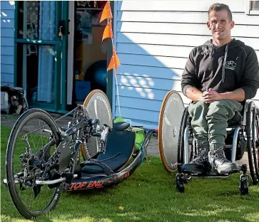  ?? VALENTINA BELLOMO/STUFF ?? Jono Nelson at home with his hand cycle.