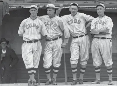  ?? CHICAGO DAILY NEWS/CHICAGO HISTORY MUSEUM ?? Cubs’ Lefty Tyler, from left, Hippo Vaughn, Phil Douglas and Claude Hendrix at Weeghman Park (renamed Wrigley Field in 1927) in 1918.