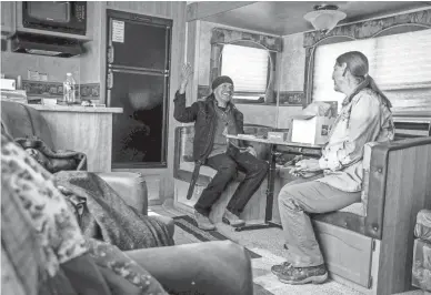  ?? ELI IMADALI/THE REPUBLIC ?? Wendsler Nosie Sr. meets with Apache Stronghold member Leslie Glass in his trailer at Oak Flat.