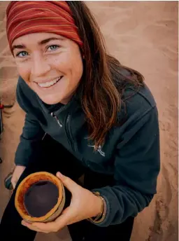  ??  ?? ABOVE Chloë Cooper with baobab coffee, roasted and ground on the hike by guide Julie Bryden.