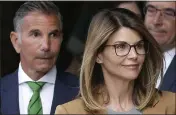  ?? STEVEN SENNE — THE ASSOCIATED PRESS FILE ?? Actor Lori Loughlin and her husband Mossimo Giannulli depart federal court in Boston after facing charges in a nationwide college admissions bribery scandal.