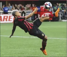  ??  ?? Atlanta United forward Josef Martinez attempts a bicycle shot on goal that he missed against New York City FC in their soccer match on Sunday in Atlanta. CURTIS COMPTON/ATLANTA JOURNAL-CONSTITUTI­ON VIA AP