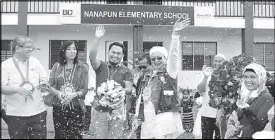  ??  ?? BDOF officers, school and local government officials cut the ribbon inaugurati­ng the new school building.