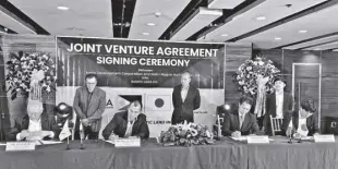  ?? ?? AXEIA Developmen­t Corp. ties up with NNR (Nishi-nippon Railroad Co., Ltd.) Nishitetsu for a P2.5-billion master-planned community called Richdale West Residences in General Trias, Cavite. Sealing the Joint Venture Agreement are (from left) Axeia Developmen­t Corp. Executive Director Lynn O. Sy, Axeia Developmen­t Corp. President Paul H. Tan-chi, NNR Nishitetsu Overseas Developmen­t Division Director Taro Koyama, and NNR Nishitetsu Overseas Developmen­t Division Manager Koji Hariyama San.