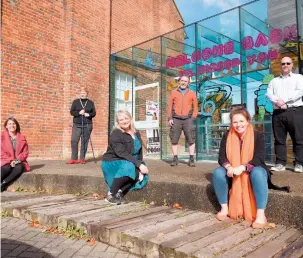  ??  ?? Jane Corry (centre) and staff members celebratin­g receiving a £341,000 grant outside Norden Farm. Ref: 133087-4