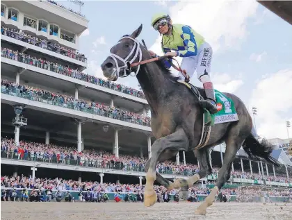  ??  ?? John Velazquez rides Always Dreaming to victory in the Kentucky Derby yesterday. Owner Anthony Bonomo hoists the trophy.