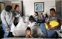  ?? Jerry Lara / Staff reporter ?? Brandy Robinson, 36, and her family take refuge at the Best Western Hotel off Loop 410 during last year’s Winter Storm Uri, which knocked out power, heat and water for millions of Texans.