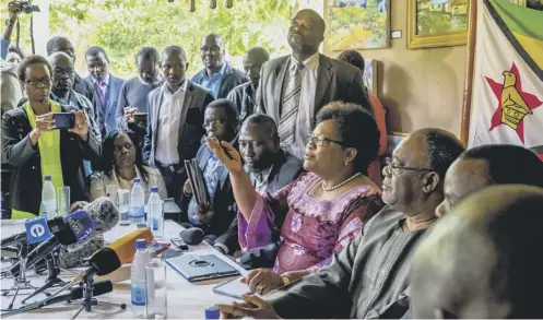 ??  ?? 0 Former vice- president and People’s Rainbow Coalition leader Joice Mujuru, third right, called for ‘ transition­al arrangemen­ts’