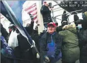  ?? U.S. Department of Justice ?? AN IMAGE from a police body camera shows Howard Richardson of King of Prussia, Pa., wielding a flagpole against officers on Jan. 6, 2021.