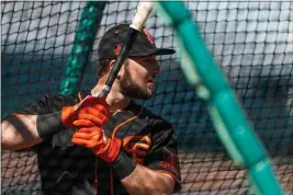  ?? PHOTOS BY RANDY VAZQUEZ — BAY AREA NEWS GROUP ?? The Giants’ Joey Bart waits for a pitch during spring straining at Scottsdale Stadium in Scottsdale, Ariz., on Feb. 12. Bart is ranked as the Giants’ top prospect by MLB.com.