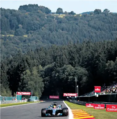  ??  ?? Open road: Lewis Hamilton powers his Mercedes down the Kemmel Straight at Spa