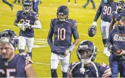  ?? NAM Y. HUH/ AP ?? The Bears and Mitchell Trubisky ( 10) walk off after the loss to the Packers but got into the playoffs with an Arizona loss.