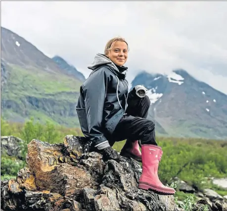  ??  ?? Greta Thunberg by the Áhkká mountain at the world heritage site of the Laponia area in Sweden in July