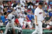  ?? MICHAEL DWYER — THE ASSOCIATED PRESS ?? Boston Red Sox’s Steven Wright, right, reacts after giving up a two-run home run to Chicago Cubs’ Anthony Rizzo, left, during the fourth inning of a baseball game, Saturday in Boston.