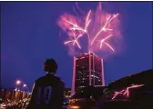  ?? Tyler Sizemore / Hearst Connecticu­t Media ?? Fireworks launched from atop the Landmark Tower light up the sky in Stamford last year.
