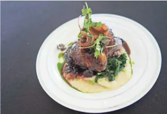  ?? PHOTOS BY DOMINIC ARMATO/THE REPUBLIC ?? Applewood-smoked elk tenderloin with Gorgonzola grits, rapini, crostini and huckleberr­y port reduction from Different Pointe of View.