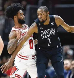  ?? PAUL BEATY/AP ?? With Kevin Durant (battling Chicago’s Coby White) heading to Phoenix for a package of players and draft picks, the Nets have dismantled their starry roster and are heading toward a complete makeover.