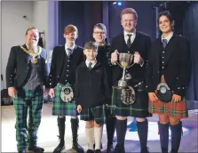  ?? Photograph: Claire Watson. ?? Lochgilphe­ad Joint Campus ‘A’ quartet receive their winners trophy.