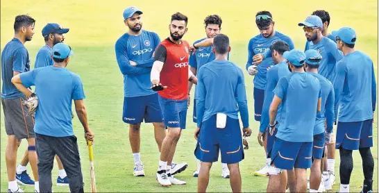  ??  ?? India captain Virat Kohli interacts with teammates during a training session in Chennai ahead of the first ODI against Australia on Sunday.