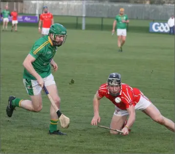  ??  ?? Prolific scorer Mikie Dwyer keeps his eye on the ball despite slipping as Barry Smith moves in.