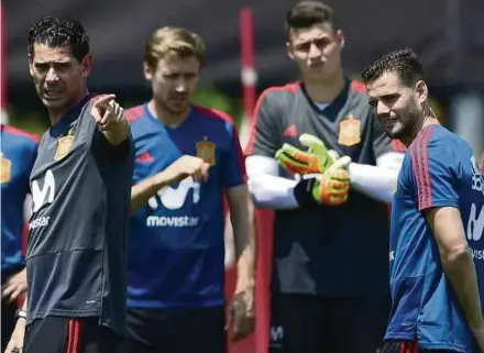  ??  ?? Spain’s coach Fernando Hierro (left) gestures during a training session at Kaliningra­d on Tuesday. AFP PIC