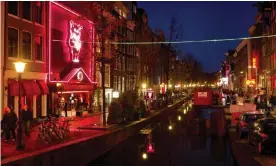  ?? Photograph: Koen van Weel/ANP/AFP via Getty Images ?? The Wallen area in Amsterdam, which the mayor is looking to move out of town to improve conditions for sex workers.