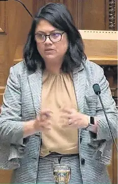  ?? PHOTO: PARLIAMENT ?? Cool, clear . . . Associate Health Minister Ayesha Verrall with a glass of fluoridate­d Wellington water.