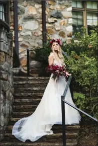  ??  ?? A wedding gown from Couture by Tess Bridal is shown by Samantha Anderson.