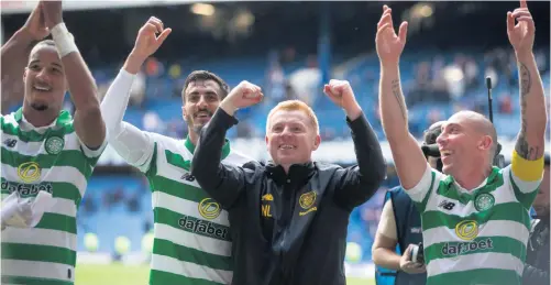  ??  ?? Better times: Neil Lennon and Scott Brown lead the Celtic celebratio­ns after a victory over Rangers at Ibrox