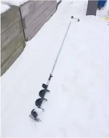  ?? | FOR SUN-TIMES MEDIA ?? Dale Rehus constructe­d this extension for his auger to be able to make holes in the ice at Navy Pier during this historic winter.