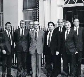  ??  ?? Cropper (centre, in grey suit) outside No 11 Downing Street in 1987, with Treasury ministers and fellow special advisers