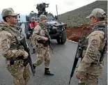  ?? PHOTO: AP ?? Turkish Army officers block the outskirts of the village of Sugedigi, Turkey, on the border with Syria, yesterday.