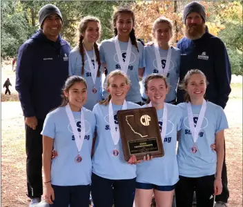  ?? Photo courtesy Rey Duarte ?? The Saugus girls cross-country team, top row from left, coach Rene Paragas, Natasha Procuik, Julia Pearson, Jennifer Thompson, coach Kevin Berns and bottom row from left, Isabella Duarte, Kaela Beretta, Hailey Rutter and Hannah Fredericks finished third overall in Division 1 at the CIF State Meet at Woodward Park in Fresno on Saturday.