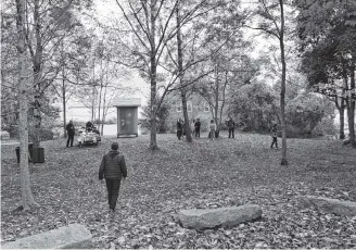  ?? Kathy Johnson ?? People arrive at The Secret Park in Shelburne for the unveiling and dedication of a carved panel created by renowned Mi’kmaw artist Ed Benham on Saturday, Oct. 13.