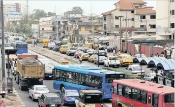  ??  ?? Motorists queue to buy fuel in Lagos. Sub-Saharan Africa’s second-largest crude producer has seen government revenue squeezed by the decline in global oil prices.