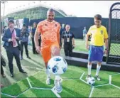  ?? PROVIDED TO CHINA DAILY ?? Brazilian soccer legend Bebeto (right) and former Dutch national team player Ruud Gullit show off their skills during a promotion event for smartphone maker Vivo in Beijing.