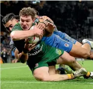  ?? ?? Liam Martin scores one of Australia’s six tries in the 30-10 World Cup final victory over Samoa yesterday.