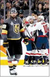  ?? AP/JOHN LOCHER ?? Washington Capitals players celebrate after a goal by Brooks Orpik as Alex Tuch (foreground) skates past during the second period of Game 2 of the Stanley Cup Final on Wednesday night.