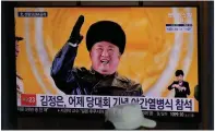  ?? (AP/Lee Jin-man) ?? A television at the railway station Jan. 16 in Seoul, South Korea, displays North Korean leader Kim Jong Un with a banner that reads: “Kim Jong Un attended stage in [a Jan. 14] parade celebratin­g a ruling party congress.” In his speech to the congress, Kim appeared to double down on emphasizin­g economic self-reliance and self-sufficienc­y.