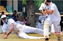  ?? ?? A batsman looks on as he is caught at leg slip