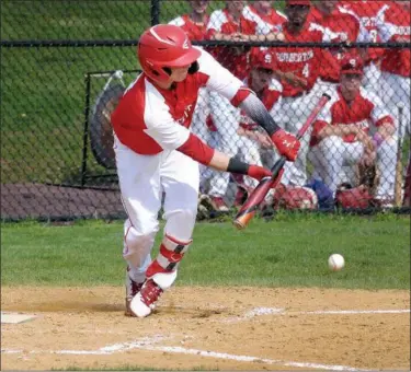  ?? GENE WALSH — MEDIANEWS GROUP ?? Souderton’s Jordan Morales lays down a bunt against North Penn.