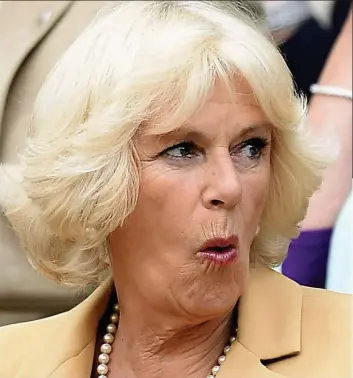  ??  ?? The Duchess of Cornwall soaks up the drama on Centre Court at Wimbledon yesterday