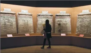  ?? GAO ER’QIANG / CHINA DAILY ?? A large-scale exhibition at the Shanghai Museum features 89 tomb-wall paintings collected by the Shanxi Museum. Most of the exhibits have never been displayed outside of Shanxi.