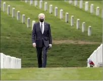  ??  ?? President Joe Biden visits Section 60 of Arlington National Cemetery in Arlington, Va., on Wednesday. Biden announced the withdrawal of the remainder of U.S. troops from Afghanista­n by Sept. 11, 2021, the 20th anniversar­y of the terrorist attacks on America.