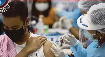  ?? PIC EPA ?? A man receiving the AstraZenec­a Covid-19 vaccine at the Bang Sue Grand Station in Bangkok recently.