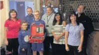  ??  ?? Life saver Representa­tives from the Robert Murphy Charity Foundation present a defibrilla­tor to Milton Football and Sports Club